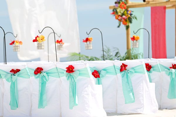 Plan Your Dream Beach Wedding in Orange Beach, Alabama Dream Beach Wedding Gulf Shores Beach Wedding Blue Sash with Red Flower Big Day Weddings